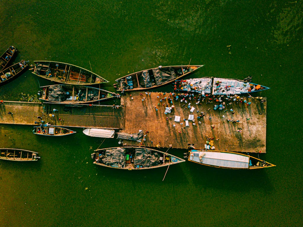 Drone shot capturing fishing boats docked in Mwanza, Tanzania harbor.